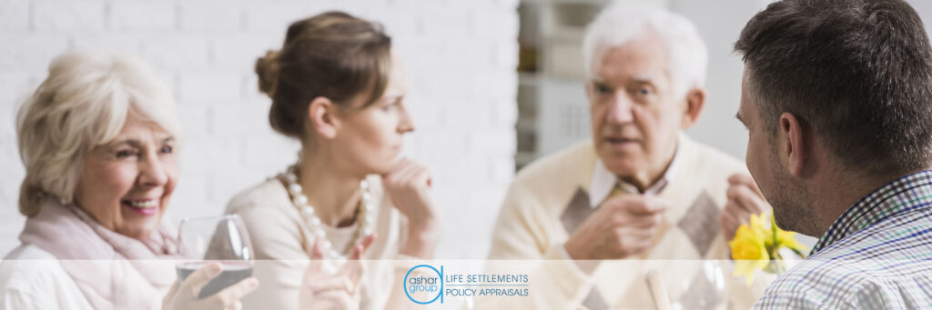 adult children having financial discussion with senior retired mother and father