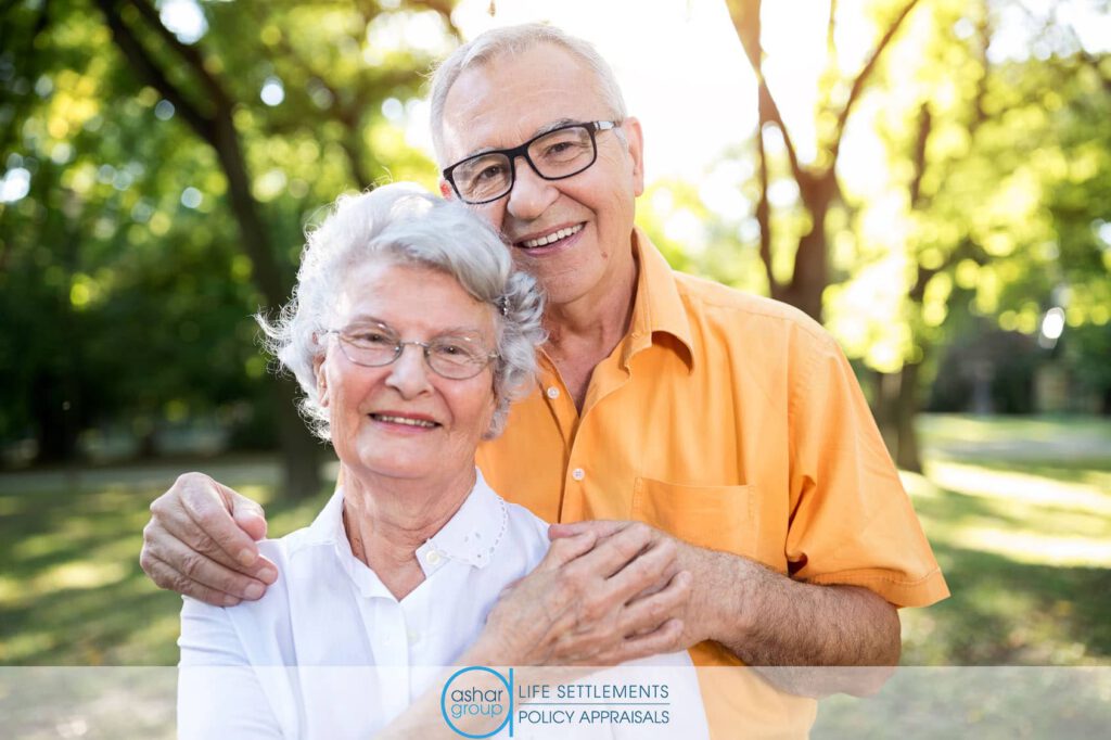 happy senior man and woman couple holding hands 