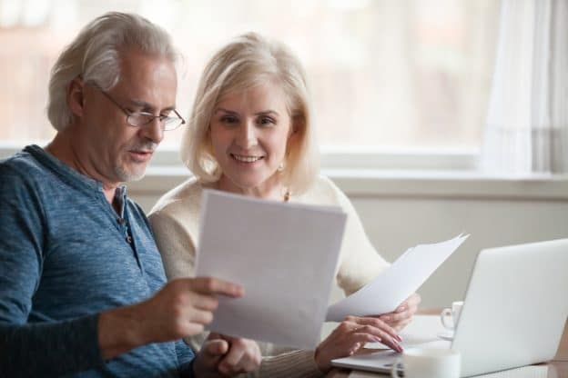 senior couple reviewing life insurance policy